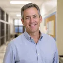 Portrait of James, a high-school principal from United States